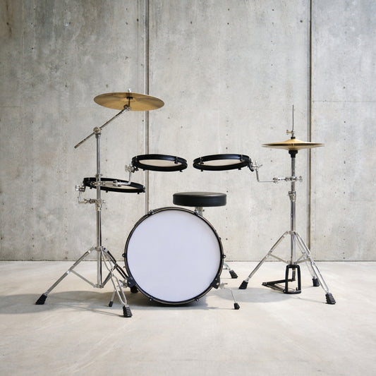 Drum set with white drum head against a concrete wall background
